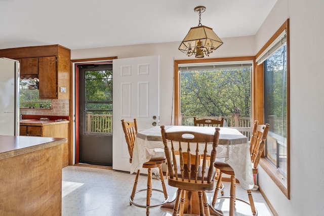 1791 S Leclerc Rd, Newport, WA 99156 - dining area with plenty of natural light and a chandelier