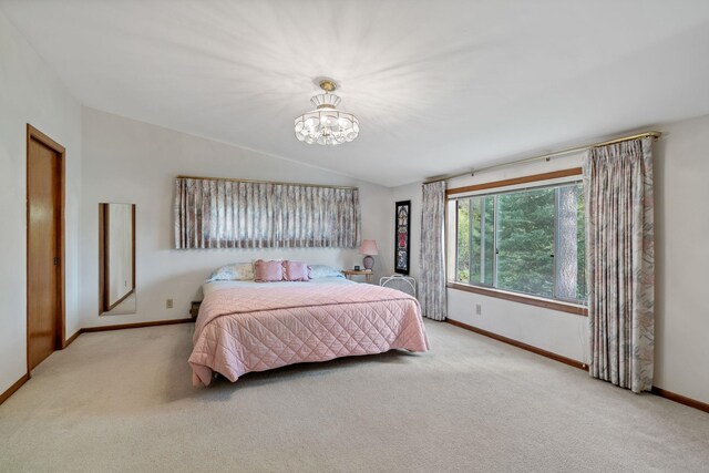 1791 S Leclerc Rd, Newport, WA 99156 - bedroom featuring carpet, baseboards, lofted ceiling, and a chandelier