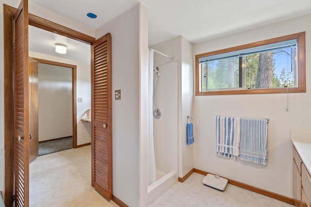 1791 S Leclerc Rd, Newport, WA 99156 - bathroom featuring a stall shower, vanity, and baseboards