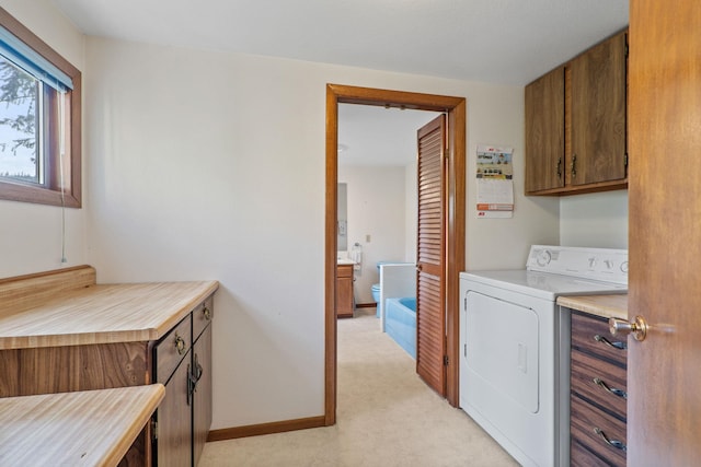 1791 S Leclerc Rd, Newport, WA 99156 - laundry area featuring washer / clothes dryer, cabinet space, light carpet, and baseboards