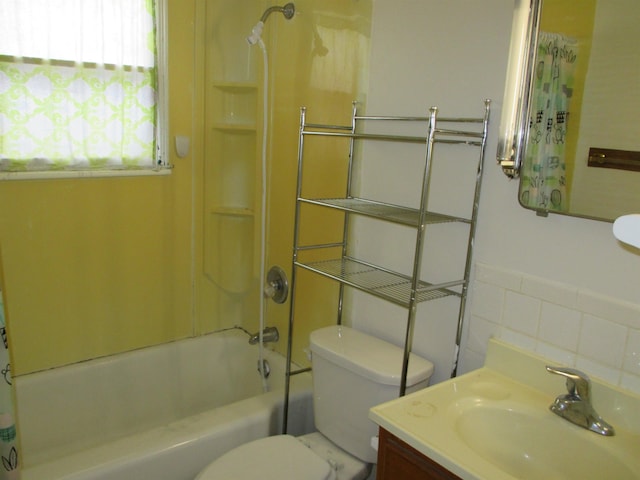 1914 W 8th Ave, Spokane, WA 99204 - full bath featuring tile walls, toilet, vanity, and shower / bath combo with shower curtain