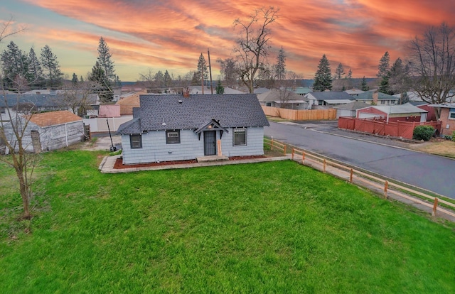 2337 W Kiernan Ave, Spokane, WA 99205 - view of front facade featuring a fenced backyard, a residential view, and a shingled roof