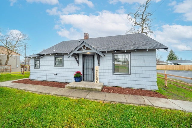2337 W Kiernan Ave, Spokane, WA 99205 - bungalow-style home featuring fence, a chimney, and roof with shingles