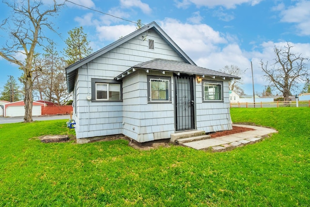2337 W Kiernan Ave, Spokane, WA 99205 - rear view of property with a lawn and a shingled roof