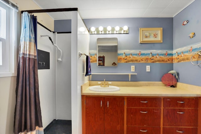 bathroom with crown molding, vanity, and a shower with shower curtain