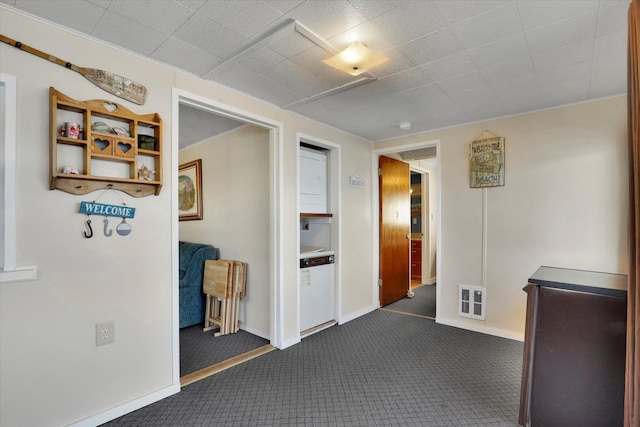 sunroom featuring lofted ceiling, carpet flooring, and a water view