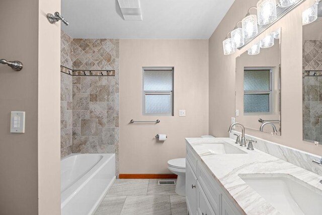 12115 E Wedgewood Ct, Spokane, WA 99217 - bathroom with baseboards, double vanity, shower / washtub combination, and toilet