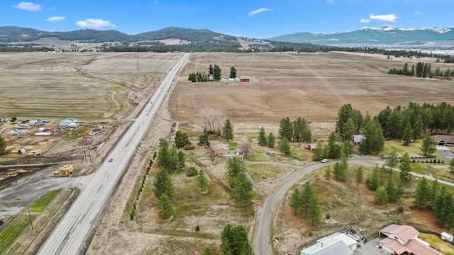 12115 E Wedgewood Ct, Spokane, WA 99217 - aerial view of property's location with a mountain backdrop, rural landscape, and a major roadway