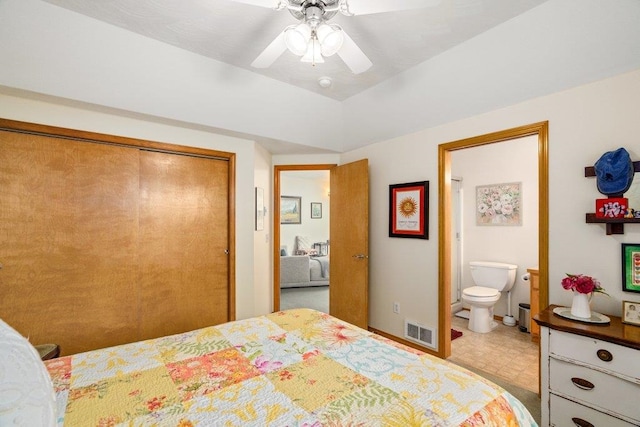 146 Laurelhurst Dr Unit 146, Newport, WA 99156 - bedroom with a closet, ensuite bath, visible vents, tile patterned floors, and ceiling fan