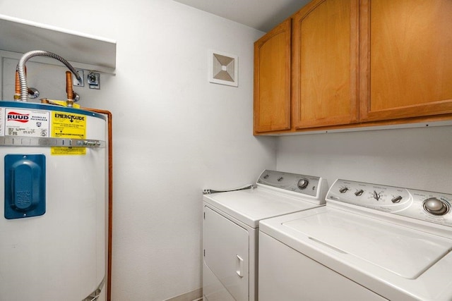 146 Laurelhurst Dr Unit 146, Newport, WA 99156 - clothes washing area with secured water heater, cabinet space, separate washer and dryer, and visible vents
