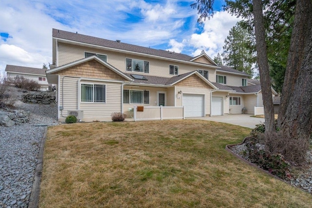 146 Laurelhurst Dr Unit 146, Newport, WA 99156 - view of front facade featuring a garage, a front lawn, and driveway