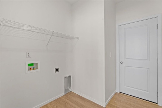 laundry room featuring light wood-style floors, laundry area, hookup for an electric dryer, and hookup for a washing machine