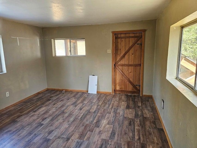 3610 Sand Creek Rd, Kettle Falls, WA 99141 - unfurnished room featuring baseboards and wood finished floors