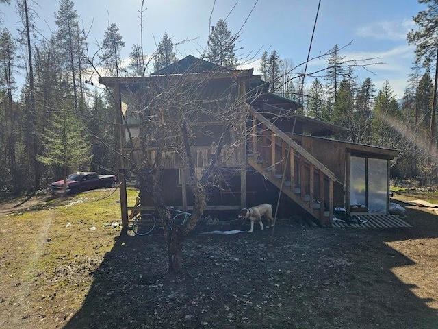 3610 Sand Creek Rd, Kettle Falls, WA 99141 - rear view of house featuring stairway