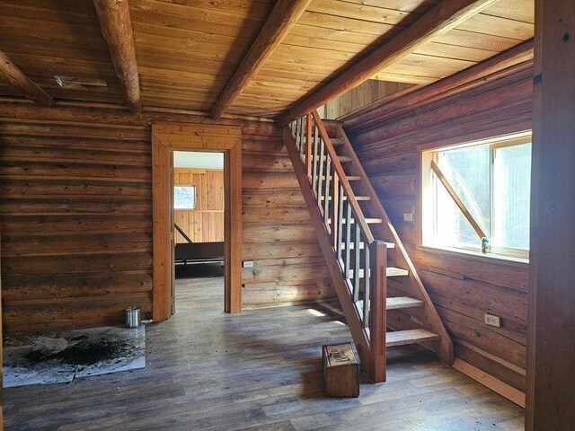 3610 Sand Creek Rd, Kettle Falls, WA 99141 - stairs with wood ceiling, hardwood / wood-style flooring, and beam ceiling