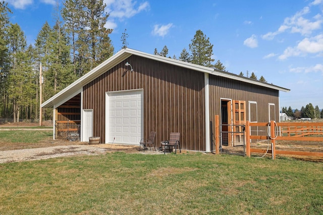 view of outbuilding with an outbuilding and fence