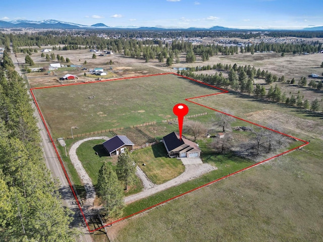 bird's eye view featuring a mountain view and a rural view