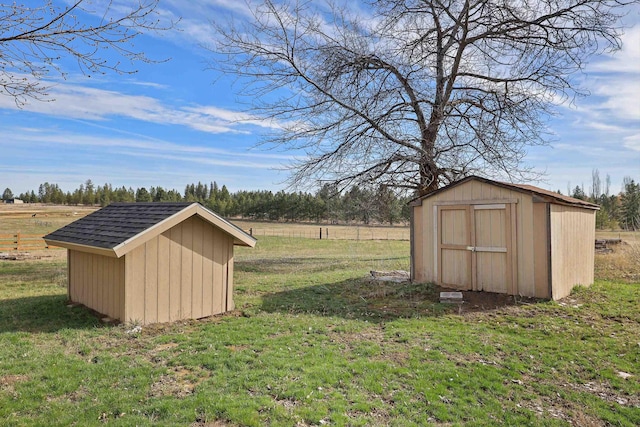 view of shed with a rural view