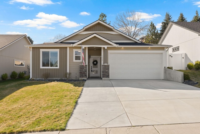 view of front facade featuring a gate, a garage, concrete driveway, a front yard, and board and batten siding