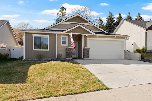 view of front of home with a gate, fence, an attached garage, concrete driveway, and a front lawn