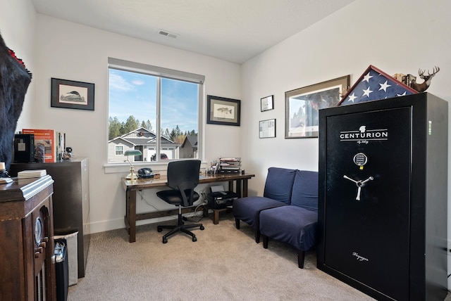 office area featuring light carpet, baseboards, and visible vents