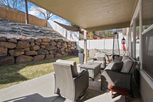 view of patio with a fenced backyard and an outdoor hangout area