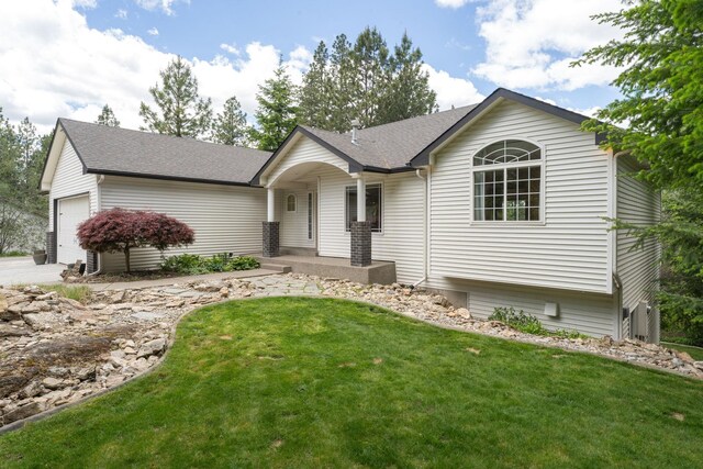 4720 S Wildwood Ln, Spokane, WA 99206 - ranch-style home with roof with shingles, an attached garage, and a front lawn