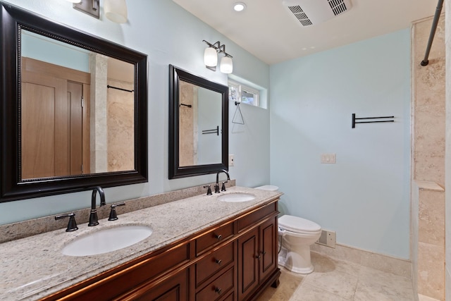 4720 S Wildwood Ln, Spokane, WA 99206 - full bathroom featuring double vanity, visible vents, toilet, and a sink
