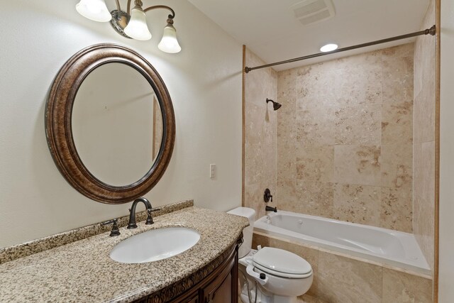 4720 S Wildwood Ln, Spokane, WA 99206 - full bathroom with tiled shower / bath combo, toilet, vanity, and visible vents