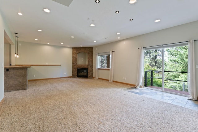 4720 S Wildwood Ln, Spokane, WA 99206 - unfurnished living room featuring light carpet, baseboards, a large fireplace, and recessed lighting