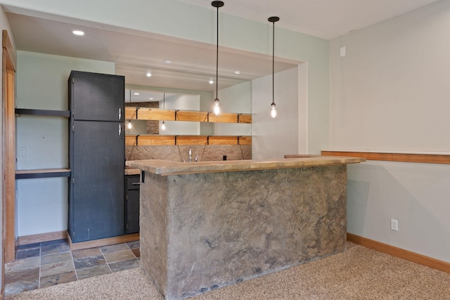 4720 S Wildwood Ln, Spokane, WA 99206 - kitchen featuring hanging light fixtures, stone finish flooring, baseboards, and recessed lighting