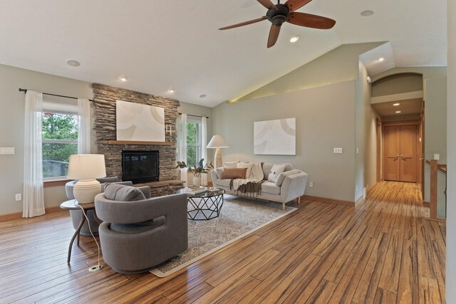 4720 S Wildwood Ln, Spokane, WA 99206 - living room with wood-type flooring, lofted ceiling, a fireplace, and ceiling fan