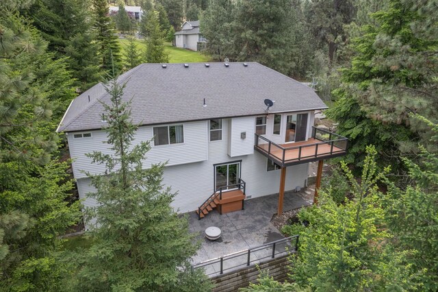 4720 S Wildwood Ln, Spokane, WA 99206 - rear view of property with a deck, a patio, and a forest view