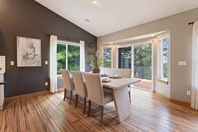 4720 S Wildwood Ln, Spokane, WA 99206 - dining space with baseboards, vaulted ceiling, and light wood finished floors