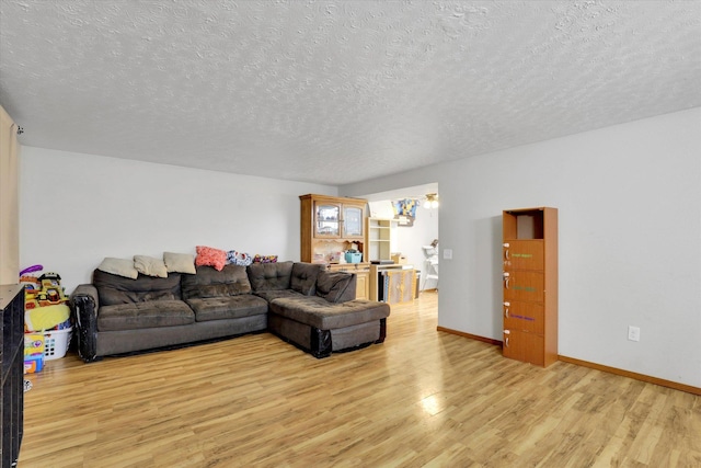908 E Rockwell Avenue 910E Rockwell Ave, Spokane, WA 99207 - living room with baseboards, a textured ceiling, and light wood finished floors