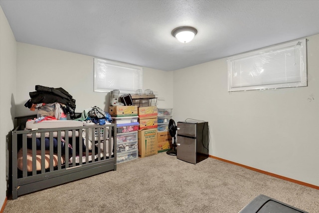 908 E Rockwell Avenue 910E Rockwell Ave, Spokane, WA 99207 - bedroom featuring baseboards, a textured ceiling, carpet, and freestanding refrigerator