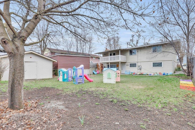 908 E Rockwell Avenue 910E Rockwell Ave, Spokane, WA 99207 - back of property with an outbuilding, a storage shed, a balcony, a lawn, and a playground
