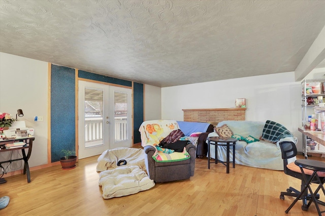 908 E Rockwell Avenue 910E Rockwell Ave, Spokane, WA 99207 - sitting room with wood finished floors, french doors, and a textured ceiling
