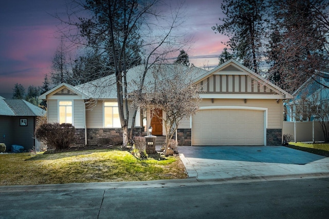 ranch-style house featuring driveway, stone siding, a front yard, and a garage