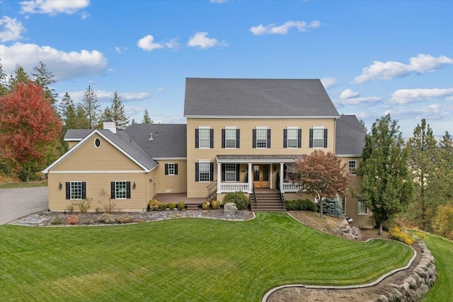 6808 S Jackson Ridge Ln, Greenacres, WA 99016 - colonial-style house featuring a porch and a front lawn