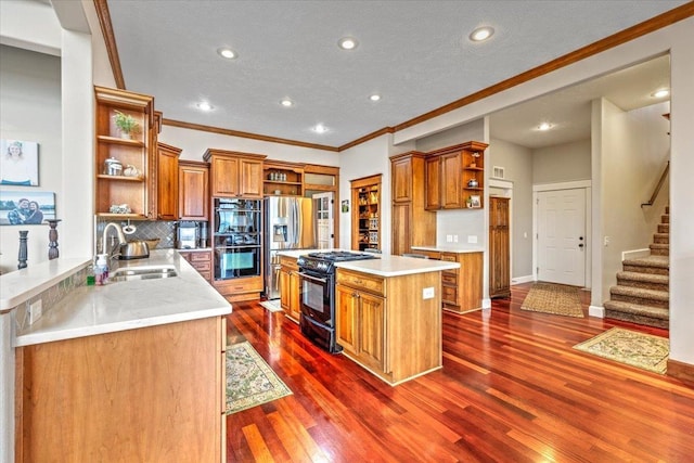6808 S Jackson Ridge Ln, Greenacres, WA 99016 - kitchen featuring brown cabinets, black appliances, a sink, and open shelves