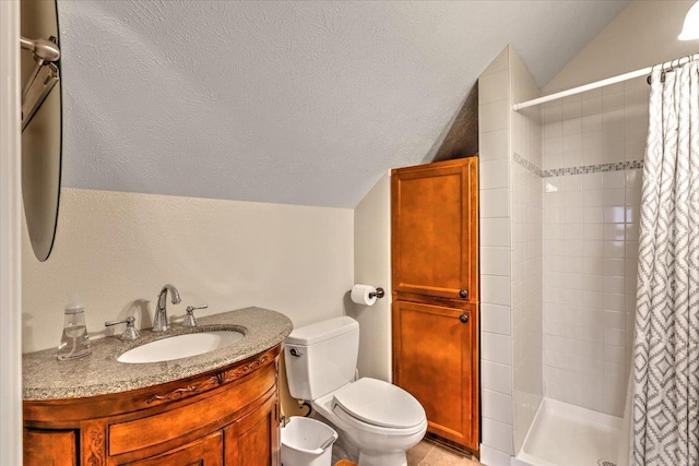 6808 S Jackson Ridge Ln, Greenacres, WA 99016 - full bath featuring a textured ceiling, a shower stall, toilet, vanity, and lofted ceiling