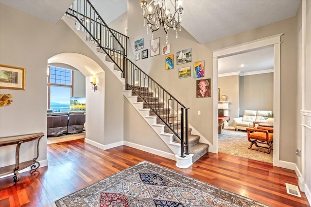 6808 S Jackson Ridge Ln, Greenacres, WA 99016 - foyer with wood finished floors, arched walkways, stairs, and visible vents