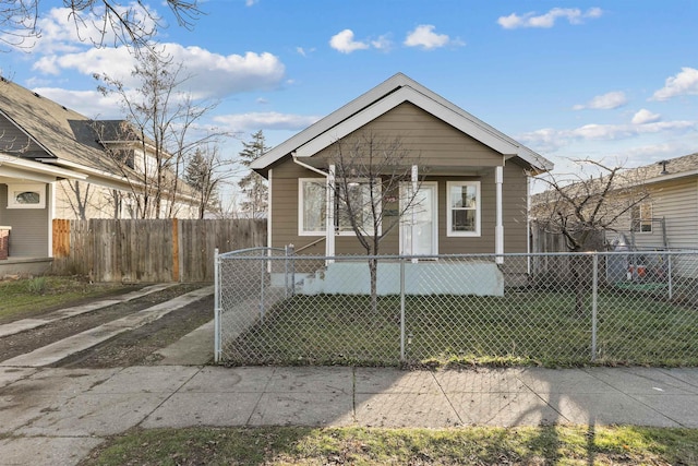 view of front of home with covered porch and a fenced front yard