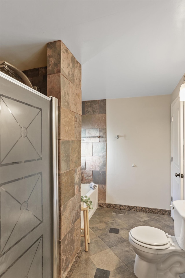clothes washing area featuring baseboards, washer / dryer, laundry area, and a sink