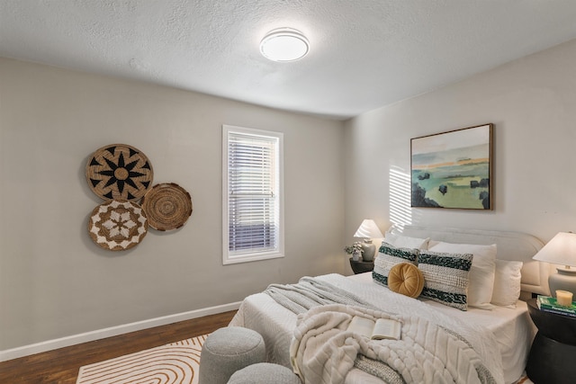 living area with plenty of natural light, baseboards, and dark wood finished floors