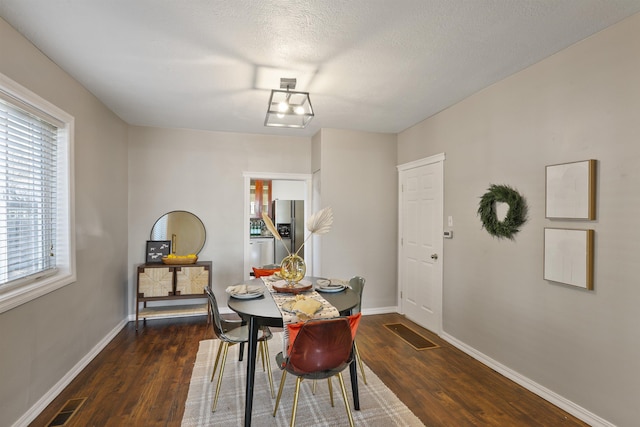 kitchen featuring tasteful backsplash, stainless steel dishwasher, glass insert cabinets, a sink, and light wood finished floors