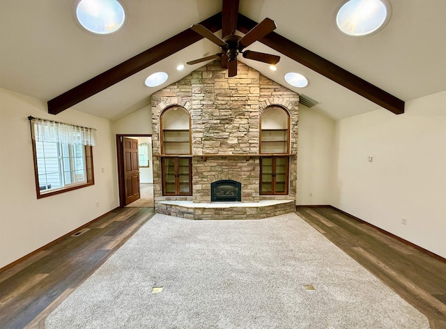 unfurnished living room with lofted ceiling with beams, visible vents, wood finished floors, and a ceiling fan