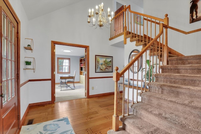 6814 S Jackson Ridge Ln, Greenacres, WA 99016 - foyer entrance featuring stairway, hardwood / wood-style flooring, baseboards, and a high ceiling