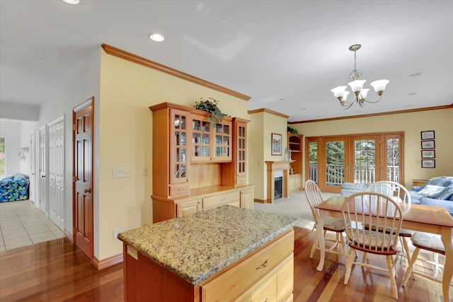 6814 S Jackson Ridge Ln, Greenacres, WA 99016 - kitchen with open floor plan, french doors, a chandelier, glass insert cabinets, and recessed lighting
